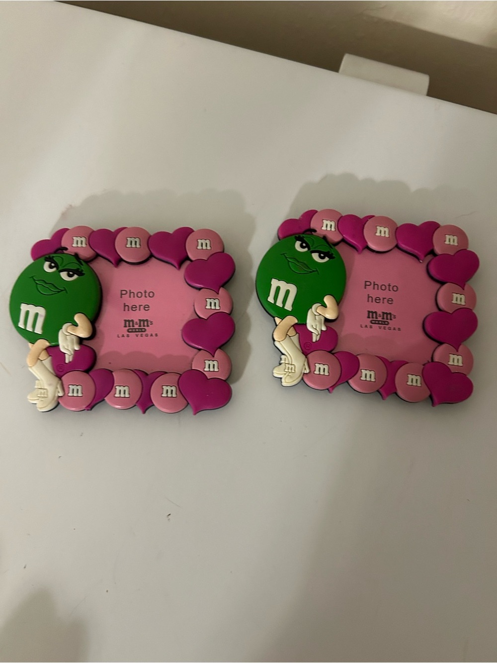 Two vintage M&M magnetic picture frames green and pink